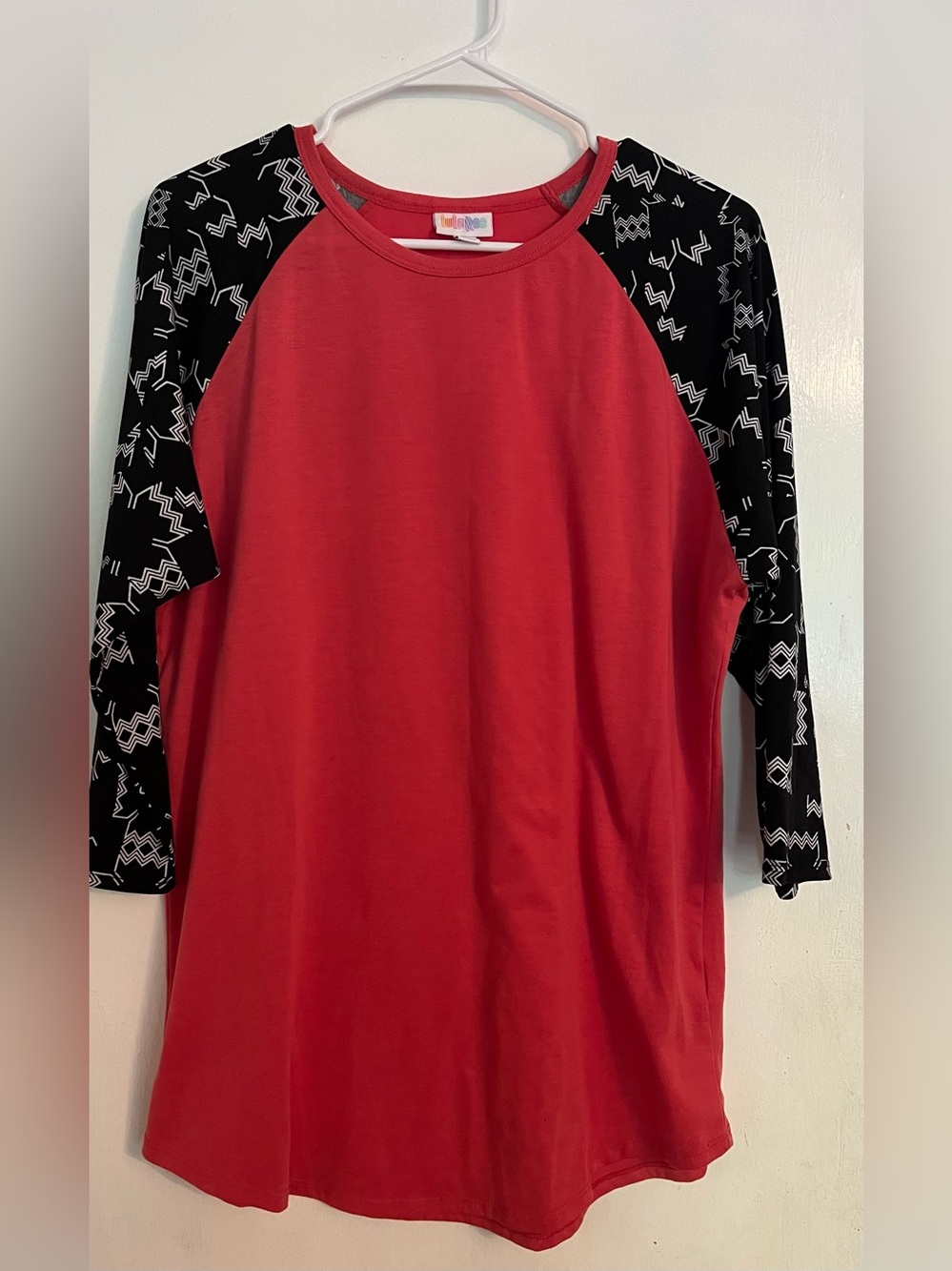 LuLaRoe Coral Raglan Top with Black Geometric Sleeves